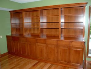 #391  Maple Breakfront featuring eight drawers and doors in the bottom section.  The upper section has adjustable shelves and crown moulding Finish:  Cherry stain and satin lacquer